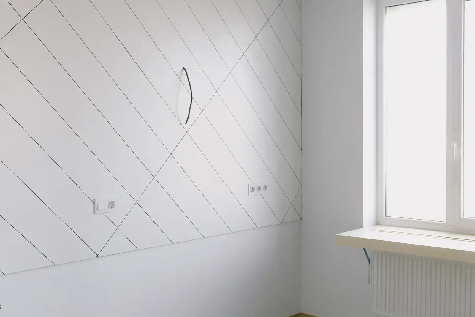 Bare, unfinished room with exposed wiring: a typical kaal rental in the Netherlands